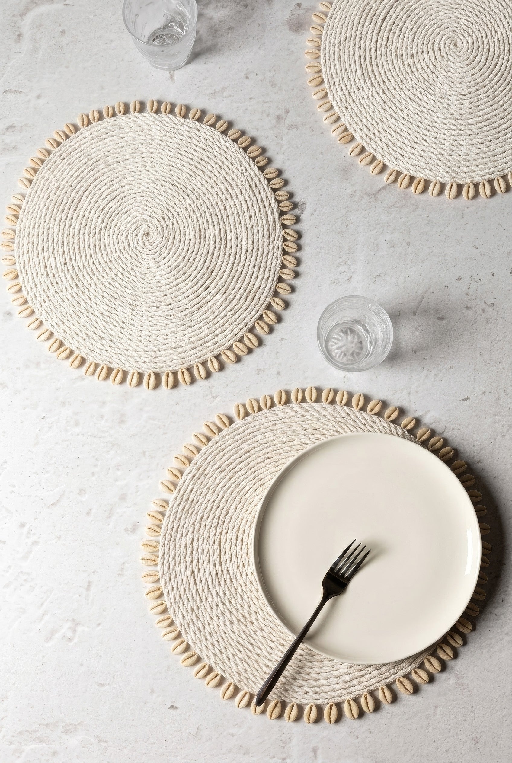 Kerang white seagrass placemats with shell edging in a table setting